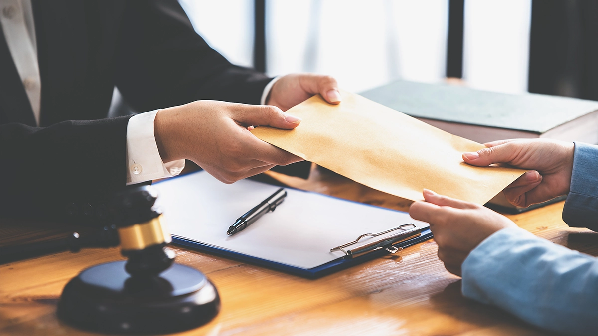 2024 05 29 Attorney handing trust documents to client